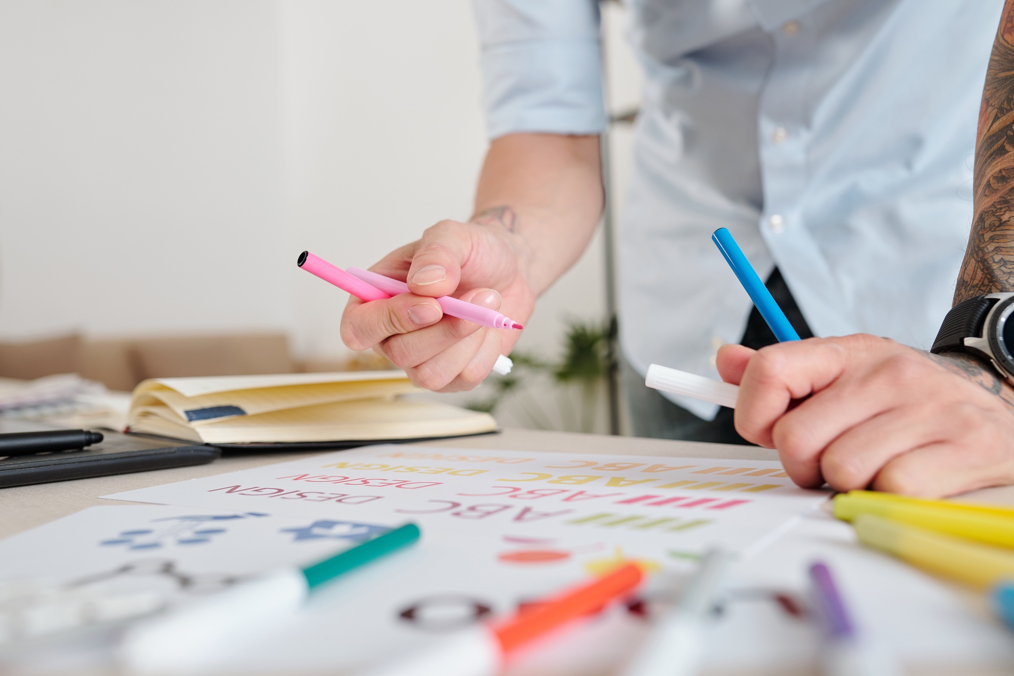Designer drawing with colorful felt-tip pens