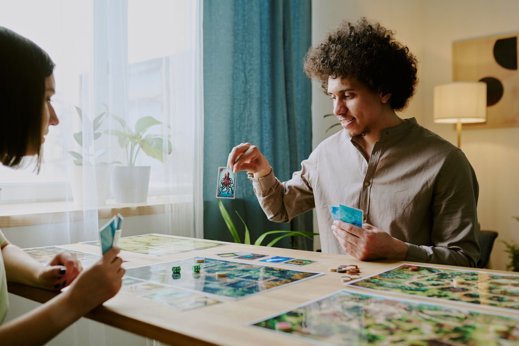 Man Showing Card While Playing Board Game