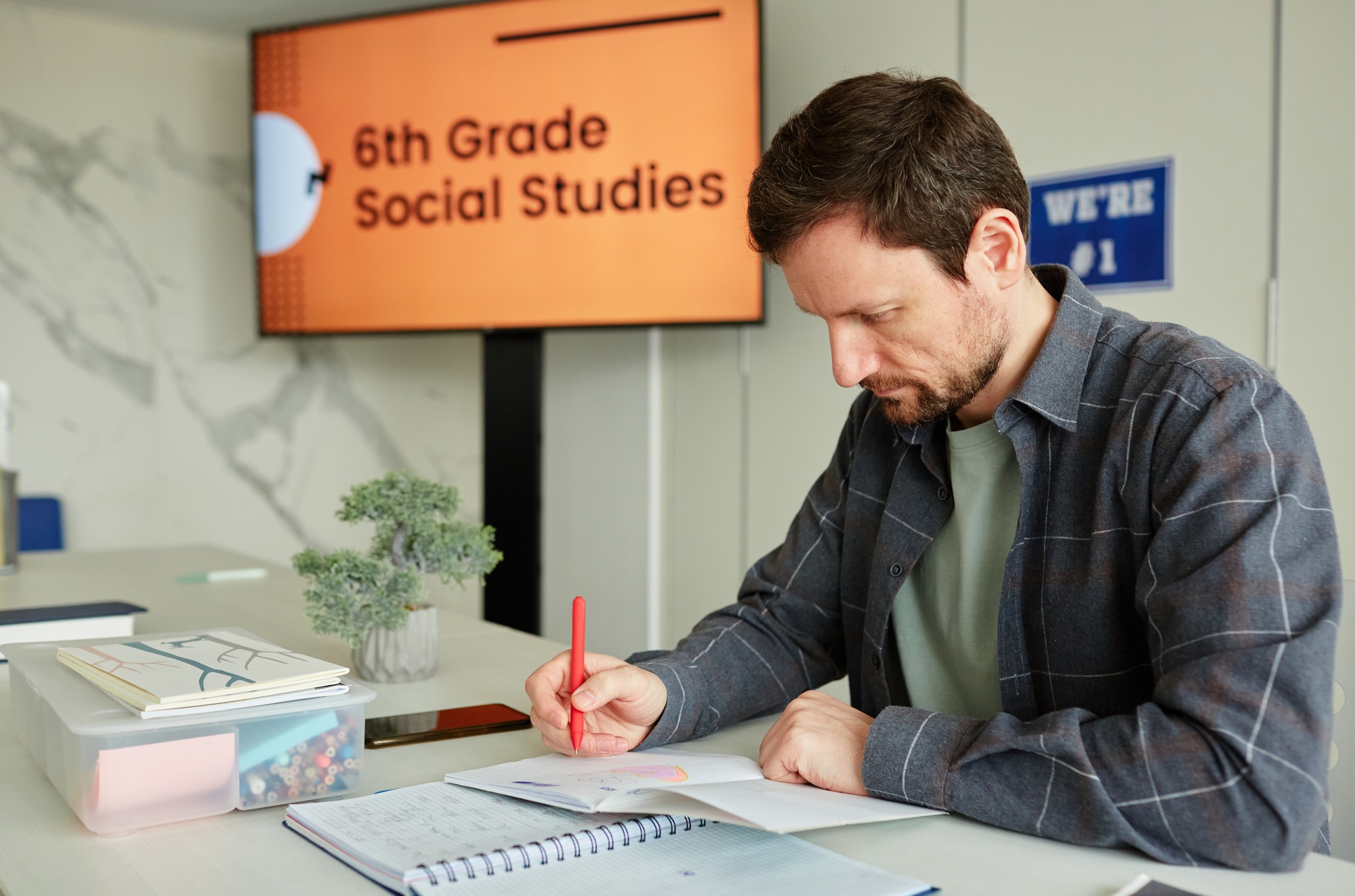 Teacher Grading Tests in School